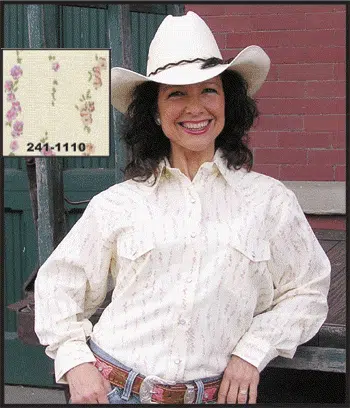 A woman wearing a cowboy hat and a cowboy shirt.