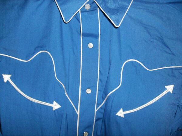A blue shirt with white arrows on it.