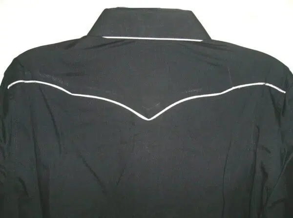 The back of a black jacket with white piping.
