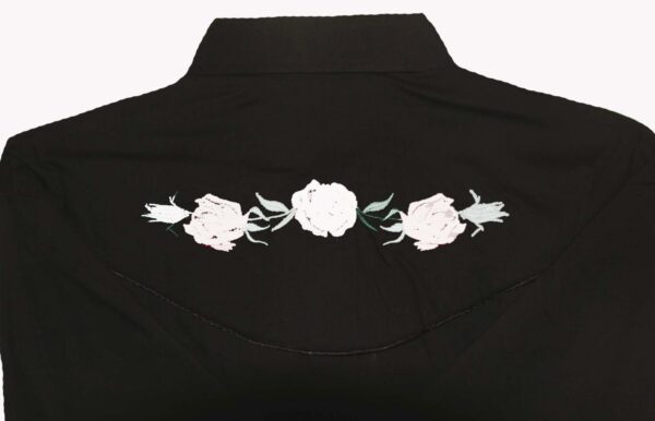 A black shirt with embroidered roses on the back.