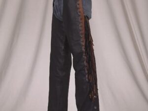 A man wearing a pair of black leather cowboy pants.