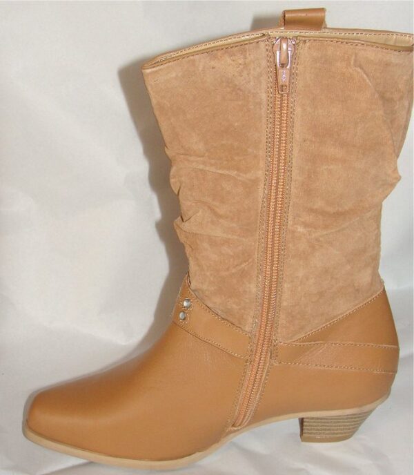 A pair of tan boots with a zipper on the side.