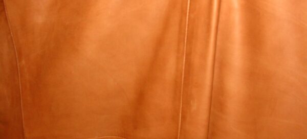 A close up of a Mens Scully Ranch Tan Italian Lamb Leather Whip Stitch Western Blazer.