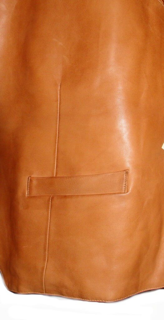 A Men's Scully Lambskin Leather Traditional Ranch Tan Western Vest with a zipper.