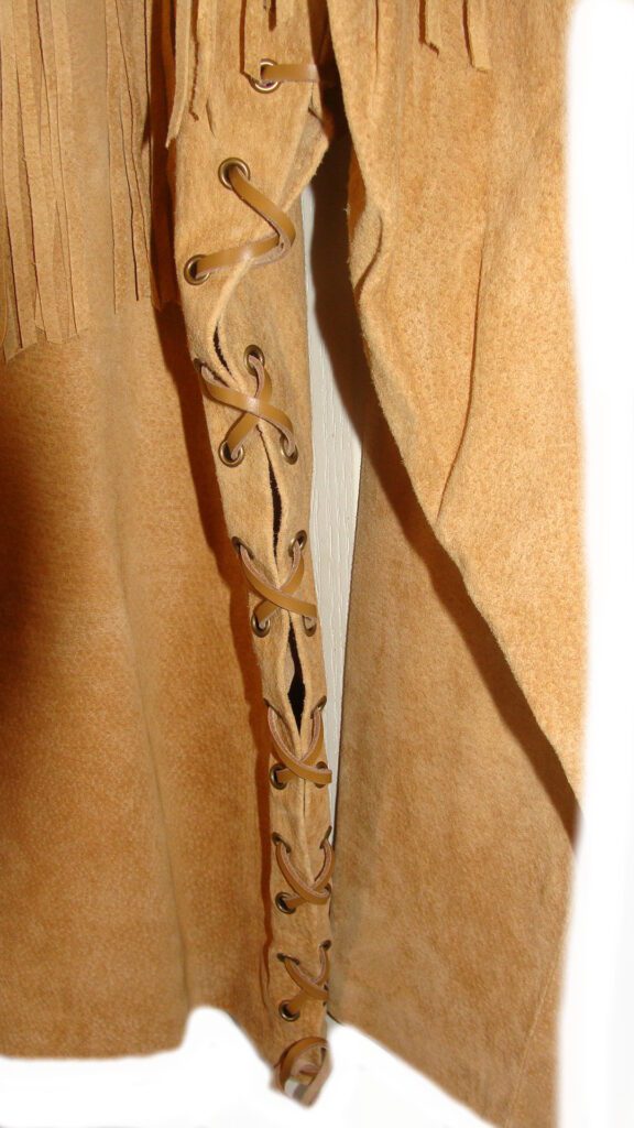 A close up of a Mens Scully Bourbon suede western fringe Daniel Boone shirt with fringes.
