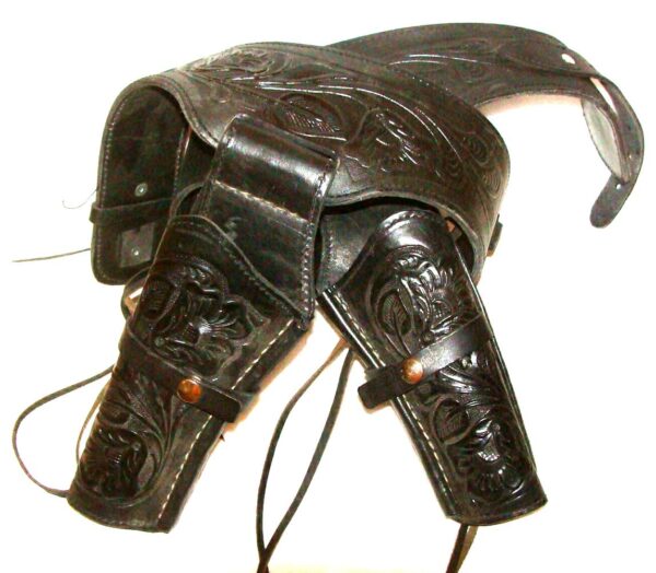 A black leather .38 Black Tooled Leather Cowboy Western Double Gun Holster with a leather strap.