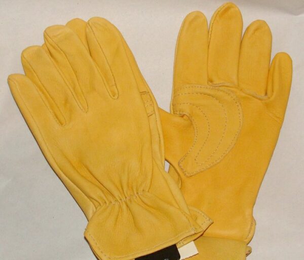 A pair of Deerskin leather western riding Roper gloves USA made on a white surface.
