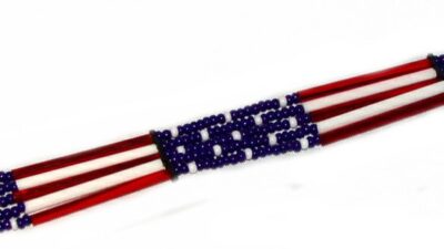 A bracelet with Glass quill 5 strand "USA Flag" USA MADE hat band beads on it.