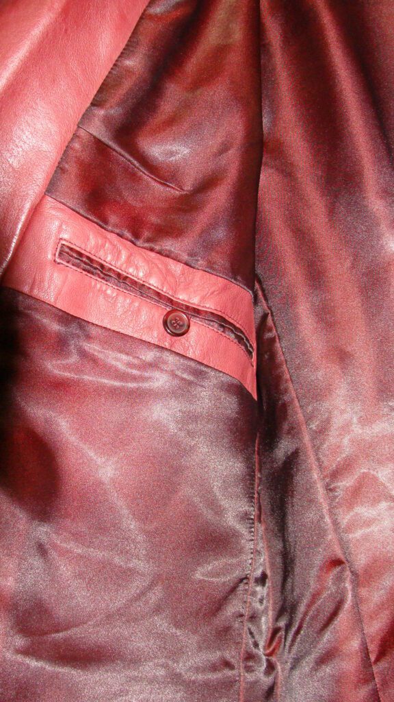 A close up of a Mens Scully Black Cherry Lambskin Leather Western blazer.