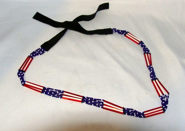 A Glass quill 5 strand "USA Flag" USA MADE hat band on a white surface.