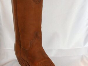 A pair of Women's Western Nubuck leather distressed cowboy boots on a white background.