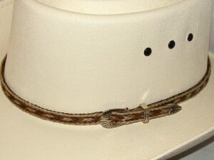A white cowboy hat with a Sterling Silver Buckle, Blond Brown Horse hair hat band - USA.