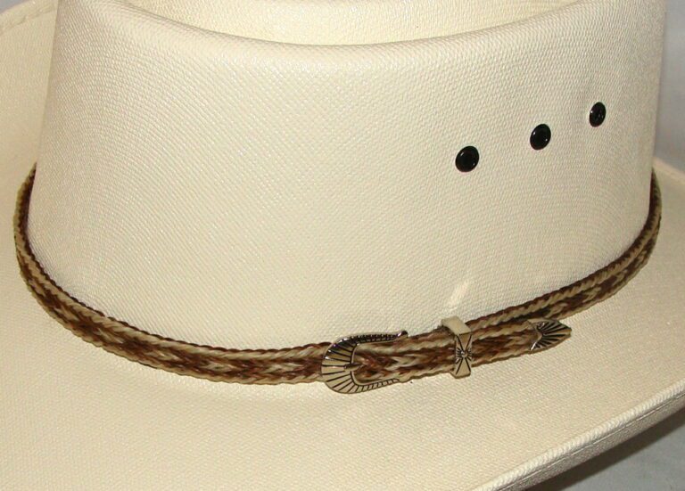 A white cowboy hat with a Sterling Silver Buckle, Blond Brown Horse hair hat band - USA.