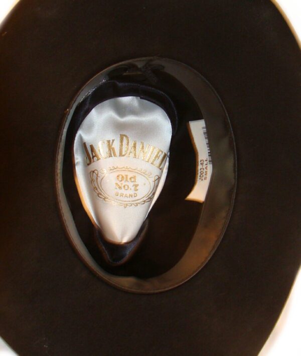 A Jack Daniel's 'Nighthawk' black wool cowboy hat USA is sitting on a table.