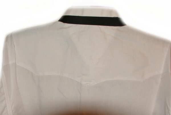 A Men's Indian head Button Banded collar White Tuxedo shirt with black trim on a mannequin.