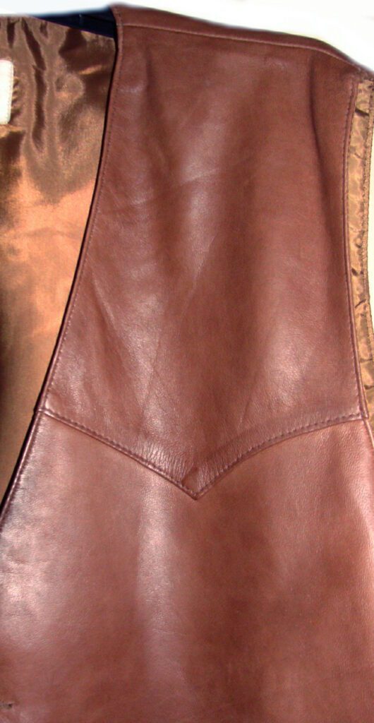 A Mens Scully Lambskin Leather Traditional Antique Western Vest on a white background.