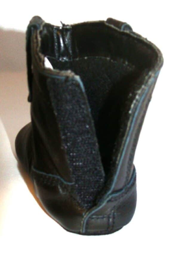 A close up of Infant Black Baby Cowboy Boots with a zipper.