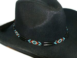A black cowboy hat with red, blue and black beads