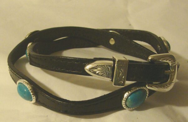 A Sterling Silver Buckle Turquoise stone black leather hat band with turquoise stones and silver buckles.