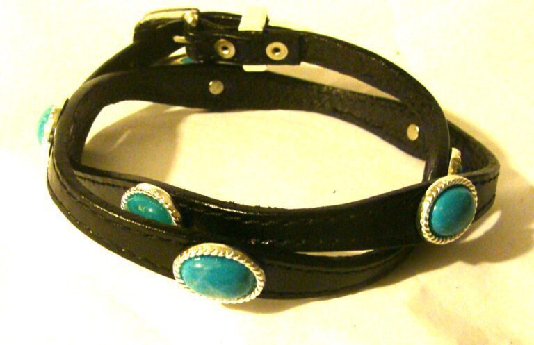 A Sterling Silver Buckle Turquoise stone black leather hat band with turquoise stones.