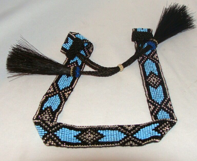 A blue and black Blue beaded Horse hair tassel Navajo hat band with tassels.
