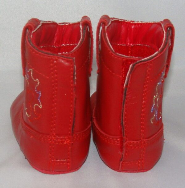 Fire Engine Red" Infant cowboy boots on a white surface.