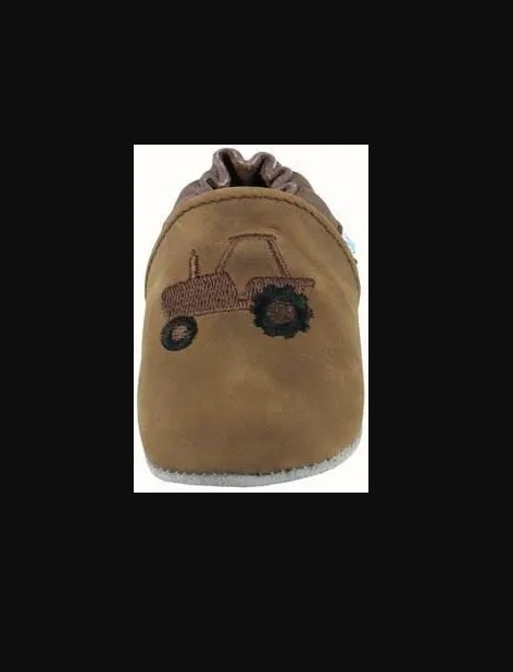 A brown WeeTractor baby bootie with a tractor on it.