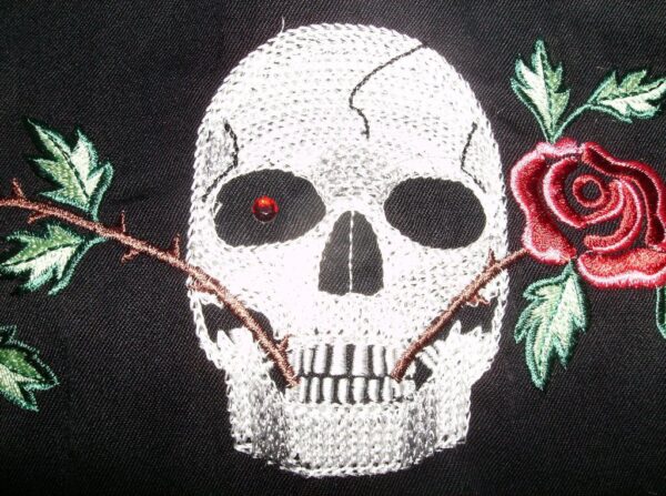 A "Skull & Roses" Scully Womens Black Western Shirt is embroidered with a skull with a rose on it.