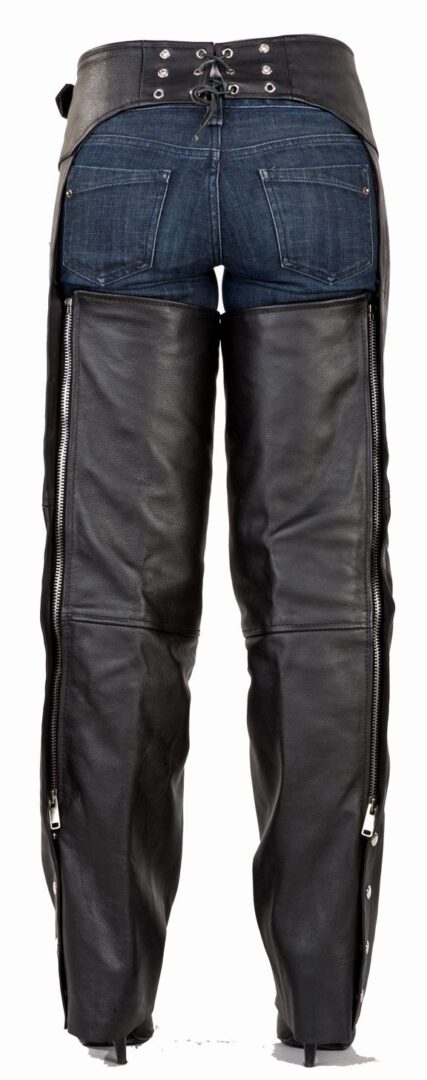 A pair of Black leather braided fringe chaps with zippers.