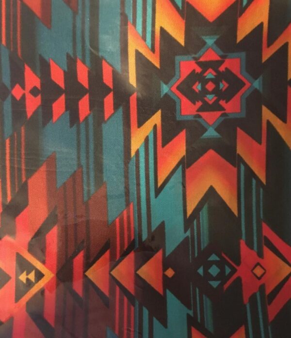 A close up of a USA MADE Aztec Orange Turquoise Silk Western Scarf design.