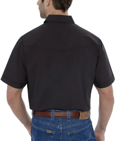 A cowboy in a black short sleeve shirt back