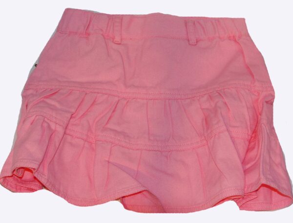 A Girls 3/4 Length Pink Denim Western Skirt with ruffles on it.