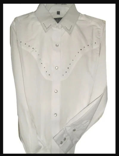 WHITE RHINESTONE Womens Long sleeve western shirt <ul> <li>65/35% Cotton blend</li> <li>Frontal Rhinestones</li> <li><strong>XL AND 2XL ONLY</strong></li> </ul> •