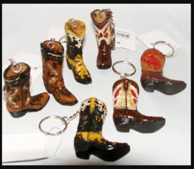 A group of Ceramic Single Cowboy Boot Keychains, Western Keyrings on a white background.