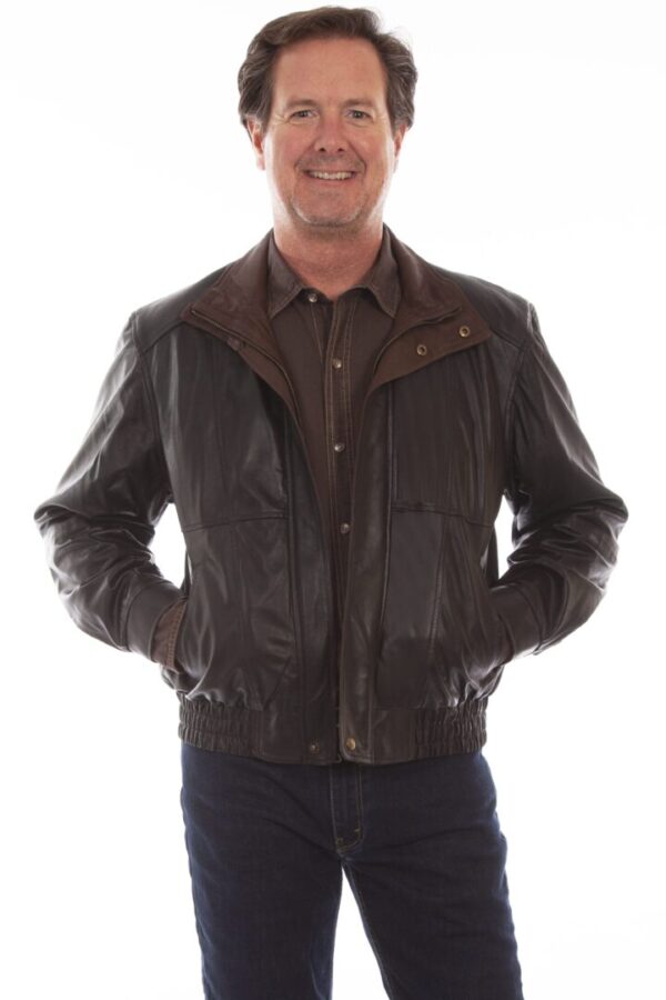 A man in a black featherlite leather double collar jacket posing for a photo.