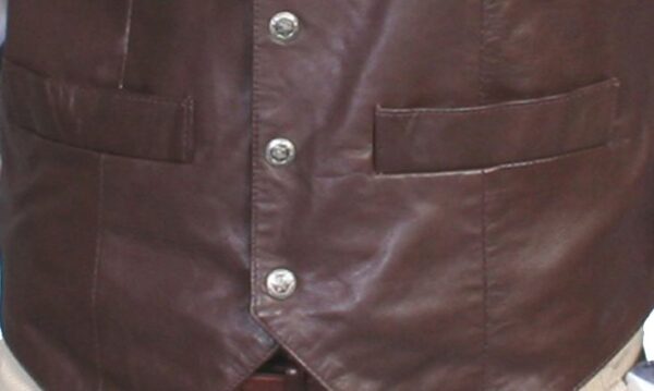 A Mens Scully Brown Lambskin Snap Front Classic Western Vest on a mannequin.