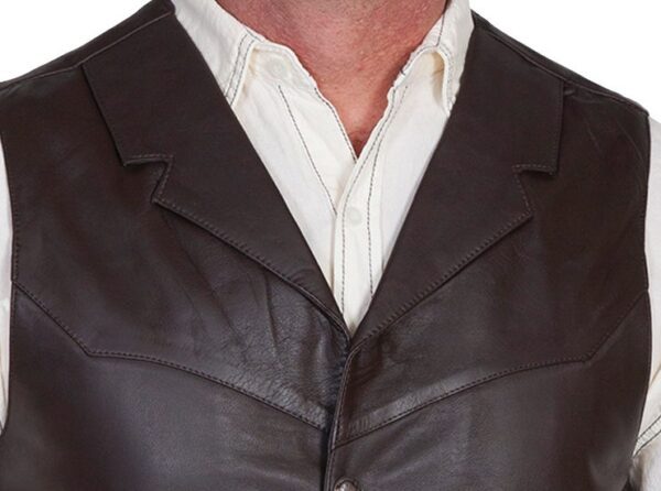 A man wearing a Mens Scully Brown Lambskin Buffalo Snap Front Western Vest.