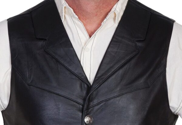 A man wearing a Men's Scully Black Lambskin Buffalo Snap Front Western Vest.