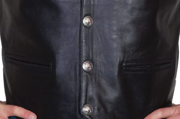 A man wearing a Mens Scully Black Lambskin Buffalo Snap Front Western Vest.