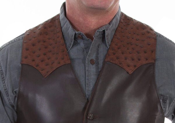 A man wearing a Mens Scully Brown lambskin leather Ostrich Western Vest with ostrich feathers.