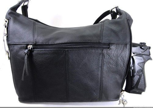 Elaine" Women's Black Leather Stud Concealed Handbag with a gun in it.