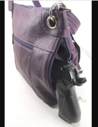 "JO" Women's Purple Leather Concealed Carry Purse with Holster <div> <ul> <li>100% Leather</li> <li>12" x 10"</li> <li><strong>WITH GUN HOLSTER </strong></li> <li>CONCEALED CARRY</li> </ul> </div> •