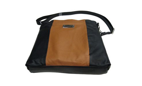 A "Brittany" Women's Black & Brown Leather Concealed Handbag with a strap.