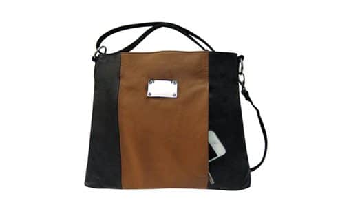 A "Brittany" Women's Black & Brown Leather Concealed Handbag with a cell phone.