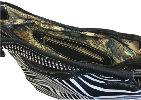 A black and white "Lisa" Women's Vegan Leather Zebra Concealed Handbag with zippers.