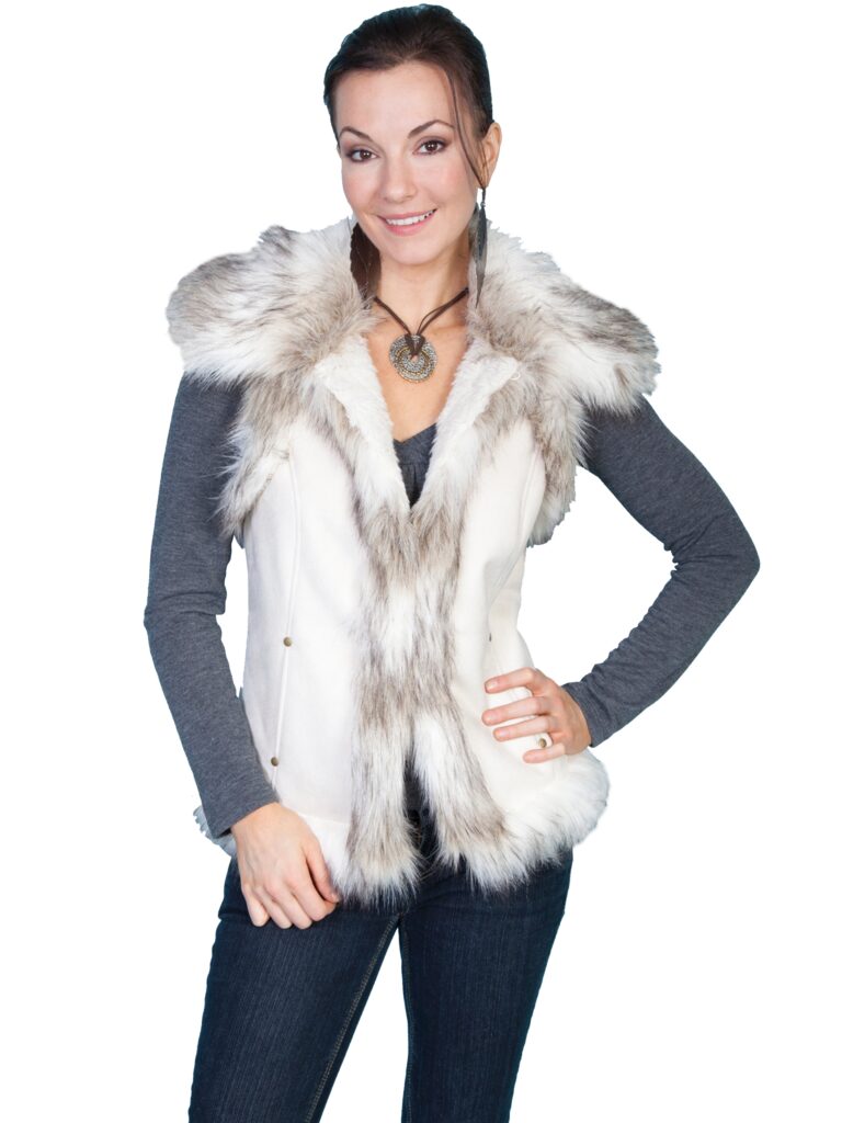 A woman wearing a Womens Scully Faux Suede, Off White Fur Western Vest.