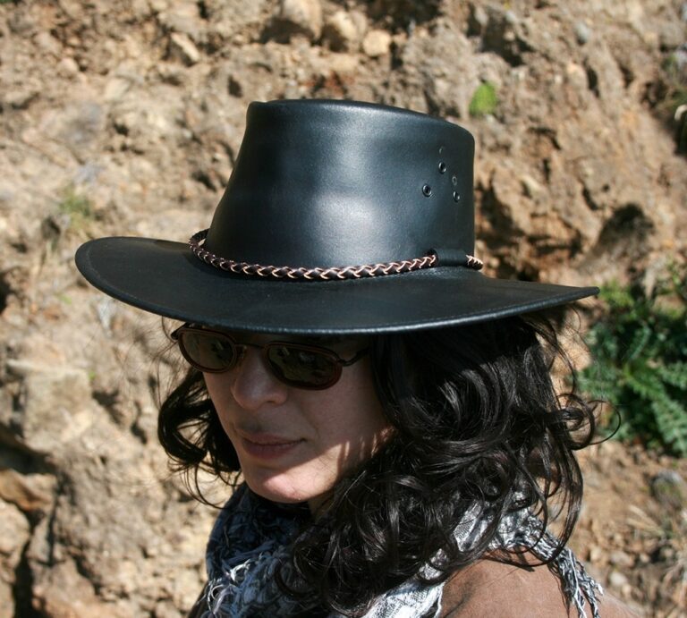 A woman wearing a "Packer" Black or Brown leather cowboy hat by Kakadu.
