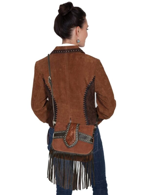The back view of a woman wearing a cowboy jacket and a Brown Leather, Suede Studded Scully Womens Fringe Handbag, Purse.