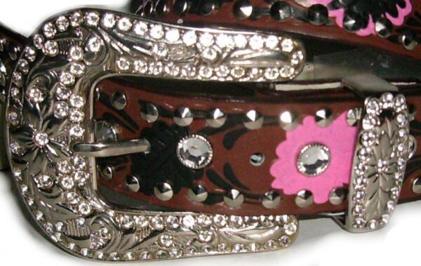 A brown tooled floral leather rhinestone western belt with rhinestones.