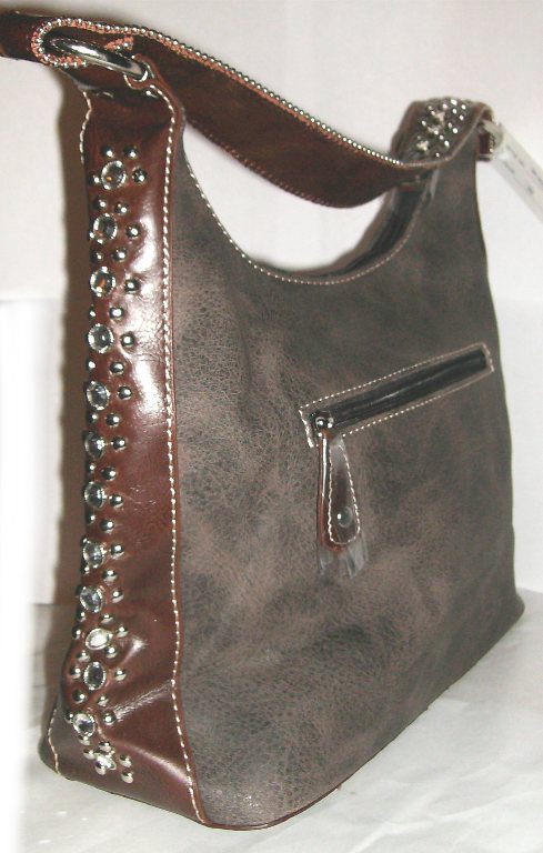 A Cross inlay brown hair on hide rhinestone western purse with studs on it.